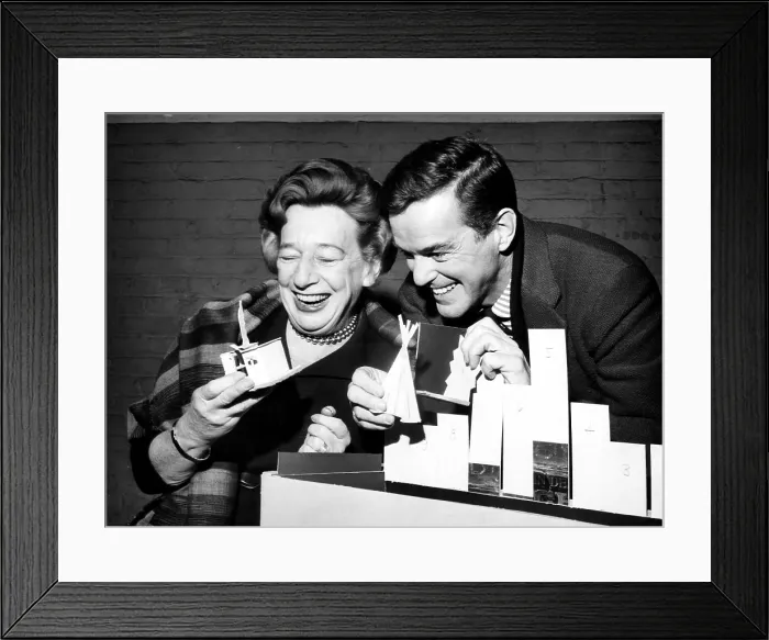 Framed Print : Playwright Lillian Hellman and Director Gower Champion handle the model of the set for the play My Mother, My Father and Me'. January 31, 1963