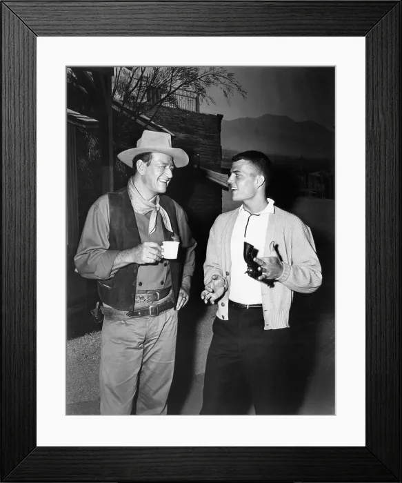 Framed Print : John Wayne, and his son, Pat Wayne, circa 1950s. Courtesy: CSU Archives / Everett Collection