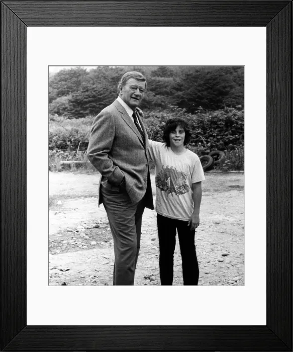 Framed Print : MCQ, John Wayne (left), with his son John Ethan Wayne, on set, 1974.. Courtesy: CSU Archives  /  Everett Collection