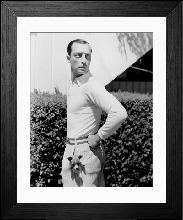 Framed Print : Buster Keaton with a puppy in his pocket