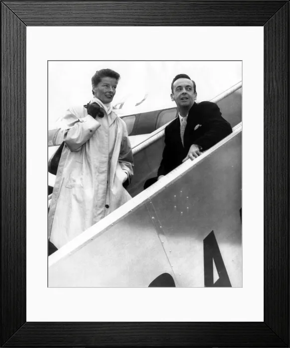 Framed Print : Katharine Hepburn and Robert Helpmann, boarding a Quantas flight to Sidney Australia where Hepburn will appear in three stage plays for the Old Vic Company Framed Print : Katharine Hepburn and Robert Helpmann, boarding a Quantas flight to Sidney Australia where Hepburn will appear in three stage plays for the Old Vic Company