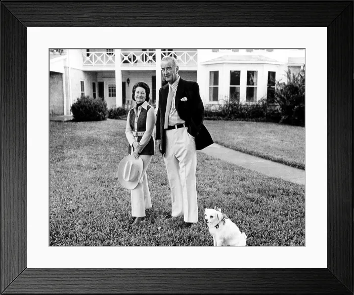 Framed Print : Lady Bird and Lyndon Johnson with their dog, Yuki, pose on the front lawn of LBJ Ranch in connection with their 38th Wedding anniversary. Stonewall, Texas, November 16, 1972