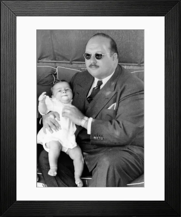 Framed Print : Former King Farouk of Egypt holding baby Prince Ahmed Fouad, Italy, August 2, 1952.. Courtesy: CSU Archives / Everett Collection Framed Print : Former King Farouk of Egypt holding baby Prince Ahmed Fouad, Italy, August 2, 1952.. Courtesy: CSU Archives / Everett Collection