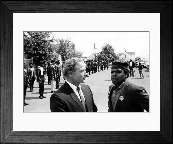 Framed Print : Marlon Brando talks with Black Panther Captain Kenny Denmon at the memorial services of a slain member of the group in Berkeley, California, 1968