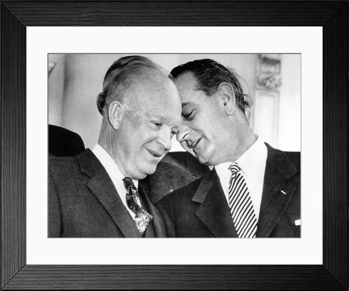 Framed Print : President Eisenhower lends an ear to Senate Majority Leader, Lyndon Johnson, following a bipartisan luncheon of Senate leaders at the White House. March 31, 1955