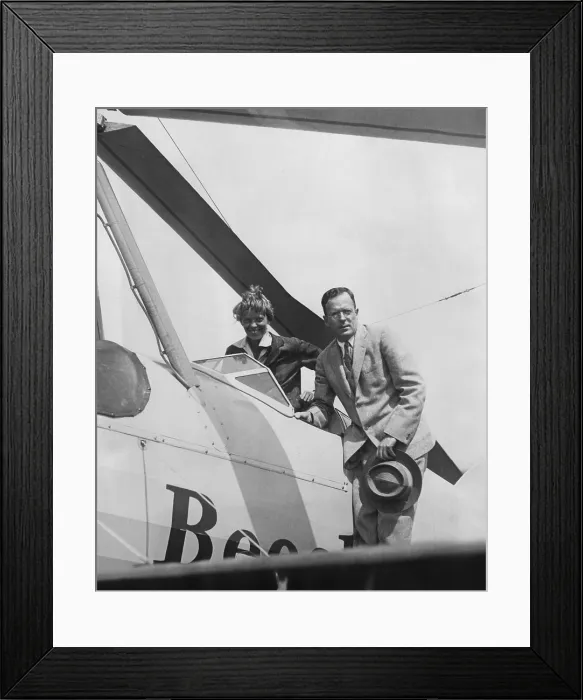 Framed Print : Amelia Earhart greeted by her husband George Palmer Putnam on her return to Newark Airport, New Jersey after a trans-continental flight. June 22, 1931