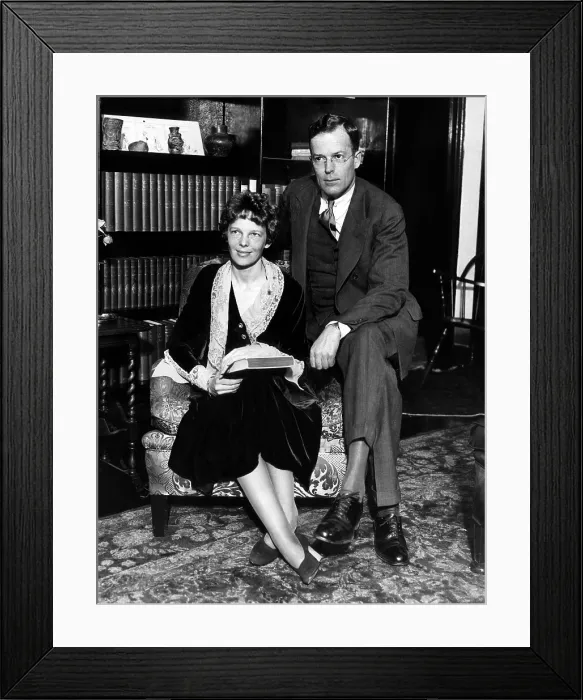 Framed Print : Amelia Earhart and her husband George Palmer Putnam in his New York office shortly after their honeymoon. February 11, 1931. Courtesy: CSU Archives / Everett Collection