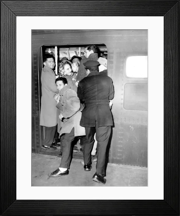 Framed Print : New York City Subways - Crowds jam onto subway trains 12 / 1957. Courtesy: CSU Archives  /  Everett Collection