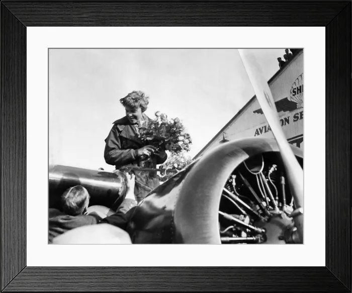 Framed Print : Amelia Earhart shown just after landing at Oakland, California Municipal Airport, on the first solo flight across the Pacific Ocean