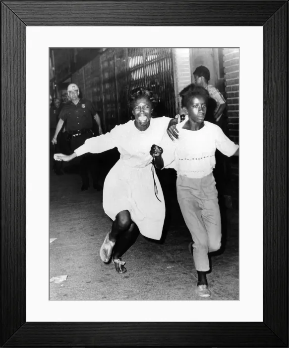 Framed Print : Two young African Americans girls, one screaming during riots in the Bedford-Stuyvesant section of Brooklyn. They were making a dash to freedom as they tried to avoid police Framed Print : Two young African Americans girls, one screaming during riots in the Bedford-Stuyvesant section of Brooklyn. They were making a dash to freedom as they tried to avoid police