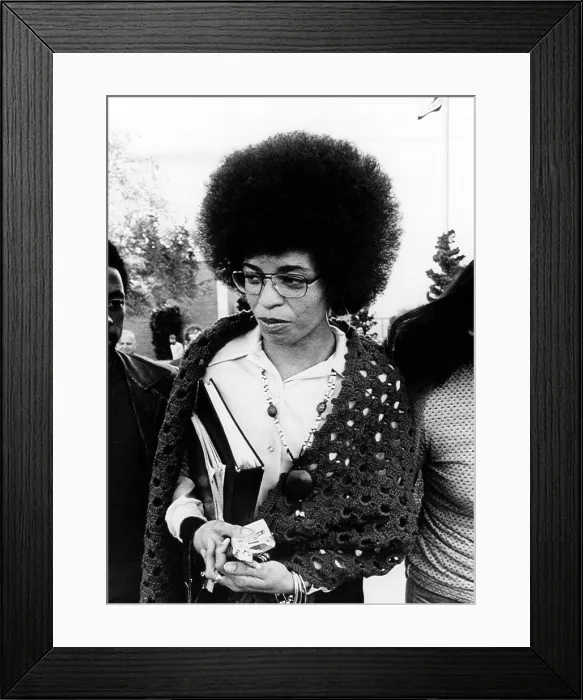 Framed Print : Angela Davis leaves the courthouse after the first day of her trial. She was charged with kidnapping, conspiracy and murder, 1972. Courtesy: CSU Archives / Everett Collection