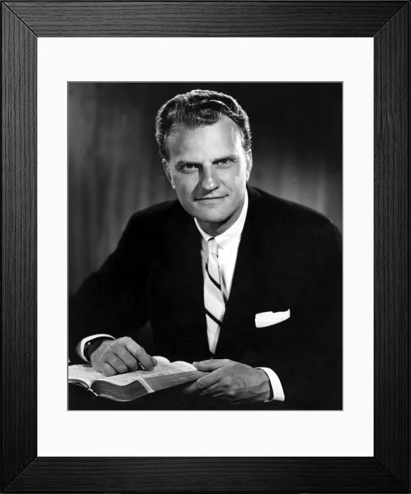 Framed Print : Billy Graham. Evangelist with Bible. Born 11 / 7 / 18 in publicity photo from 1964.. Courtesy: CSU Archives / Everett Collection Framed Print : Billy Graham. Evangelist with Bible. Born 11 / 7 / 18 in publicity photo from 1964.. Courtesy: CSU Archives / Everett Collection