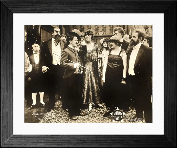 Framed Print : THE COUNT, foreground left: Charlie Chaplin, foreground second from right: Edna Purviance, 1916