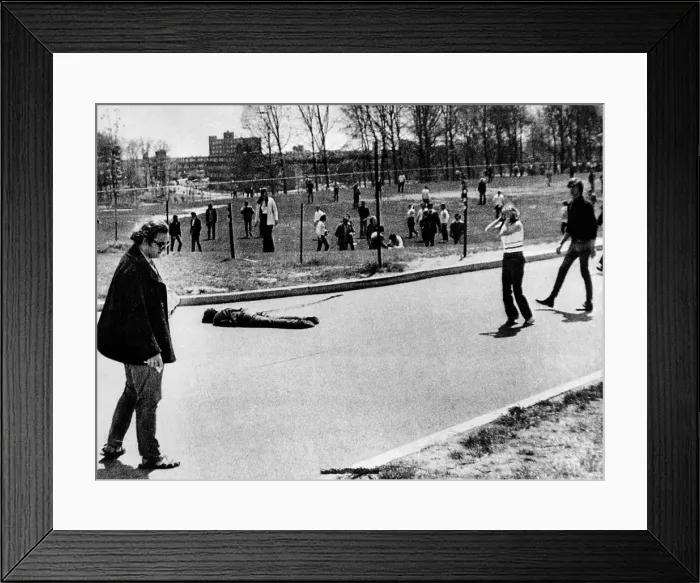 Framed Print : A student lies dead at Kent State University. He was one of 4 students killed when National Guardsmen fired 67 rounds in 13 seconds into a student demonstration. May 4, 1970