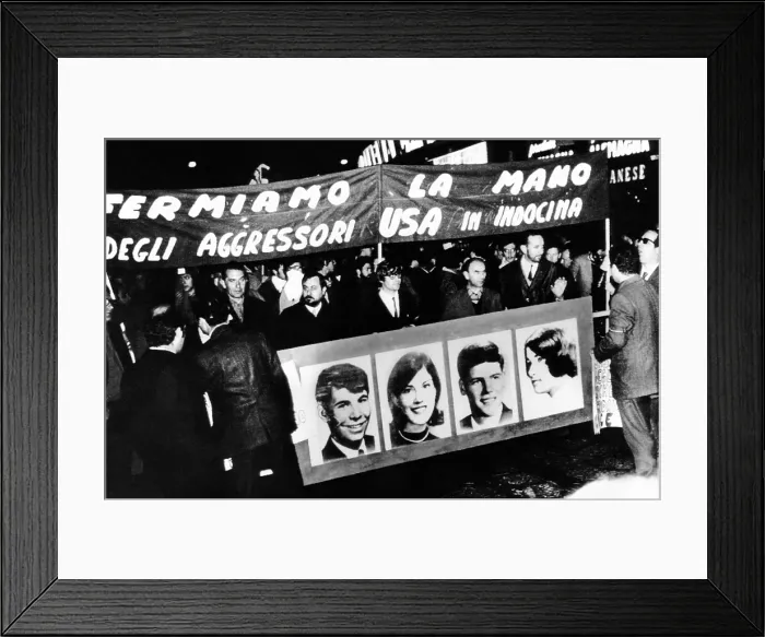 Framed Print : Anti-Vietnam War protest in Milan, Italy. The demonstrators hold a banner with pictures of the four students killed at Kent State University. May, 7, 1970