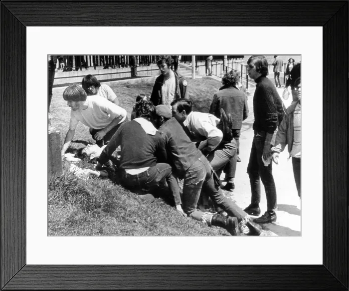 Framed Print : Kent State University students come to the aid of a wounded youth
