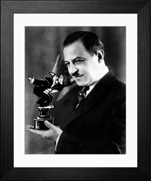 Framed Print : Cartoonist Max Fleisher holding a statue of Koko the Clown. 1920s. Courtesy CSU Archives / Everett Collection