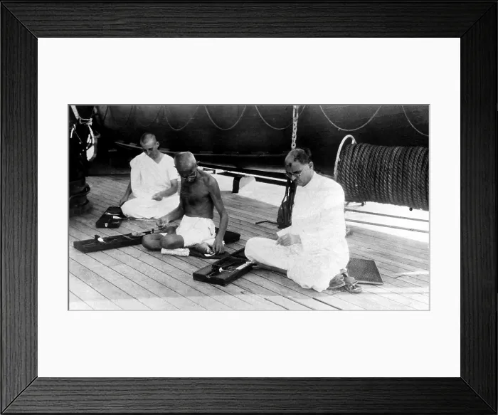 Framed Print : Mahatma Gandhi weaves cloth aboard the liner Rajputana while en route to London, England to attend the India Round Table Conference, 1931