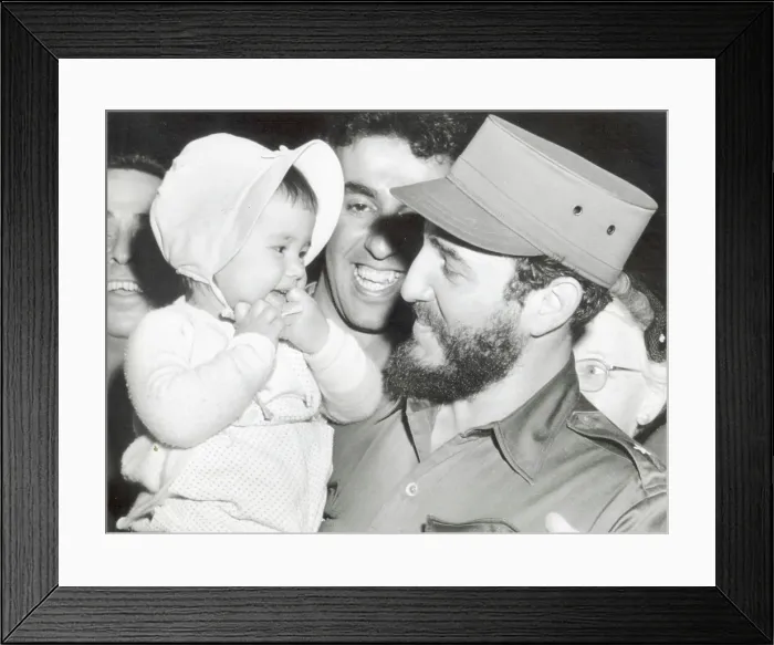 Framed Print : FIDEL CASTRO, Cuban Prime Minister, makes friends with 16-month old Sherry Robin Hayes, of Washington D.C Framed Print : FIDEL CASTRO, Cuban Prime Minister, makes friends with 16-month old Sherry Robin Hayes, of Washington D.C