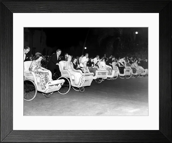 Framed Print : Fashionable members of the younger winter set at Palm Beach, Florida, lined up at the Everglades for the start of the annual 'Wheel Chair Derby'. 2 / 14 / 38