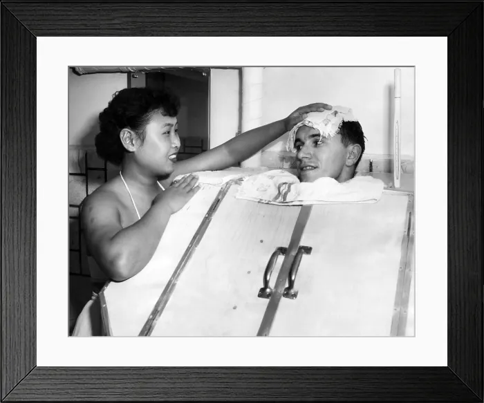 Framed Print : A Japanese masseuse applies a cold towel the the head of a GI in a steam bath.ca 1951.Courtesy: CSU Archives / Everett Collection