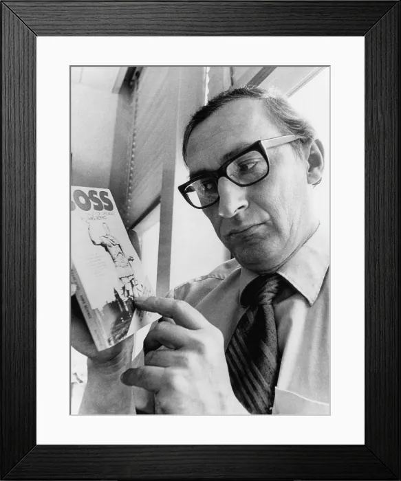Framed Print : Chicago Daily News columnist Mike Royko, (1932-1997), with a copy of his book Boss, 1971.. Courtesy: CSU Archives  /  Everett Collection