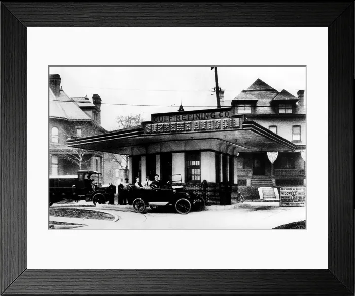 Framed Print : Three men in a highly polished Chalmers touring car wait for service at Supreme Oil Co. the world's first drive-in gas station, Pittsburgh, PA, December 1, 1913