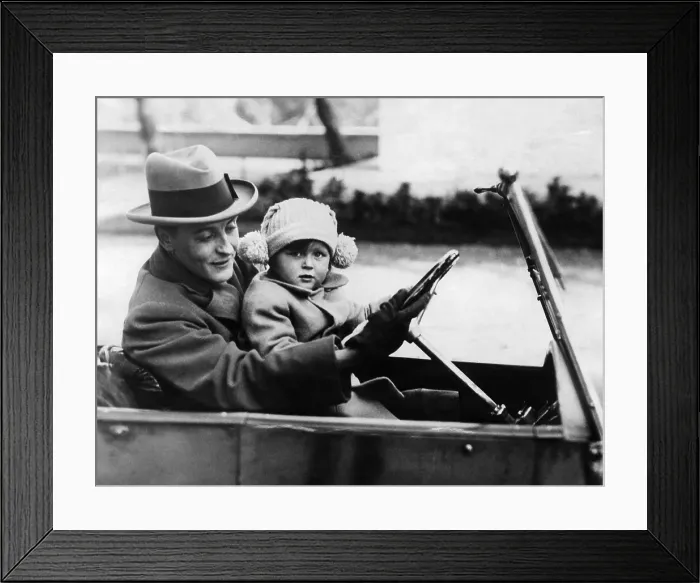 Framed Print : F. Scott Fitzgerald shows his daughter how to drive in Rome. 1924-1931. Courtesy CSU Archives / Everett Collection