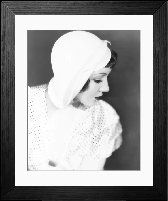 Framed Print : Claudette Colbert in summer hat desighned by Jas. Hopkins, 1934