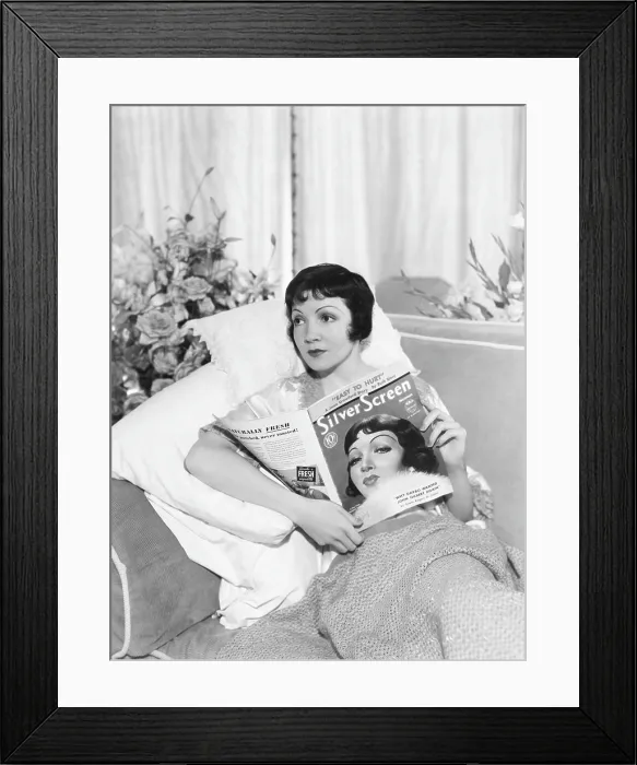 Framed Print : Claudette Colbert with copy of Silver Screen magazine which has her on the cover, 1933 Framed Print : Claudette Colbert with copy of Silver Screen magazine which has her on the cover, 1933