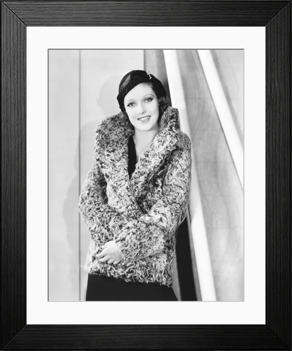Framed Print : Loretta Young in grrey curly caracul sports coat and black hat, 1932