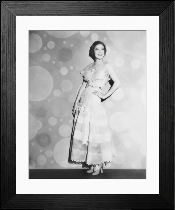 Framed Print : Loretta Young in pink organdy dress with high waist line belt, 1935