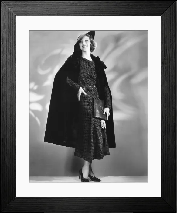 Framed Print : Loretta Young in Alaska seal cape worn over brown woolen dress designed by Nina Foley, ca. late 1930s Framed Print : Loretta Young in Alaska seal cape worn over brown woolen dress designed by Nina Foley, ca. late 1930s