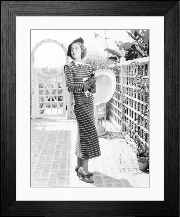 Framed Print : Loretta Young in dark blue and white striped dress covered by a soft and silvery fuzz, ca. 1936