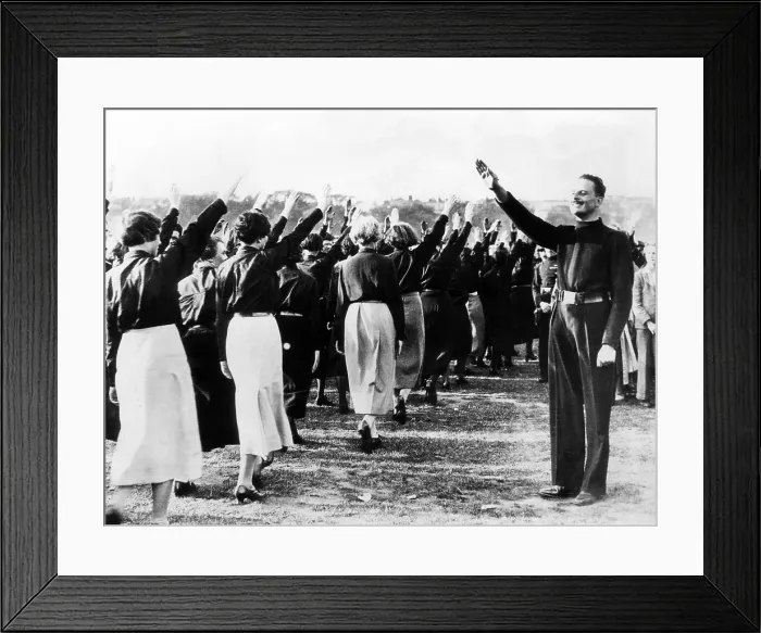 Framed Print : Sir Oswald Mosley, leader of the British Union of Fascists, taking a salue fromt he womean members of the party a sthey arrived in Hyde Park, London, for a Blackshirt rally Framed Print : Sir Oswald Mosley, leader of the British Union of Fascists, taking a salue fromt he womean members of the party a sthey arrived in Hyde Park, London, for a Blackshirt rally