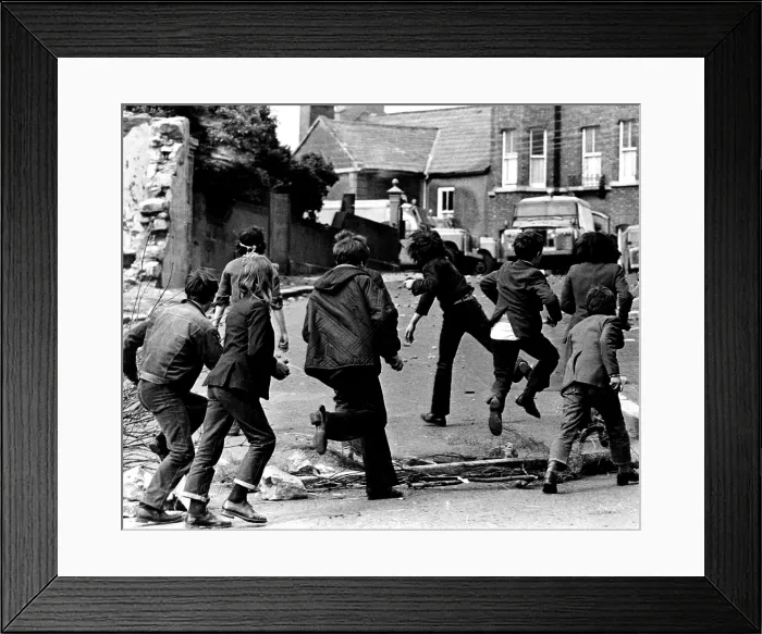 Framed Print : Irish children throwing rocks at a British armored car in Armagh, Northern Ireland, 1972. Courtesy: CSU Archives  /  Everett Collection