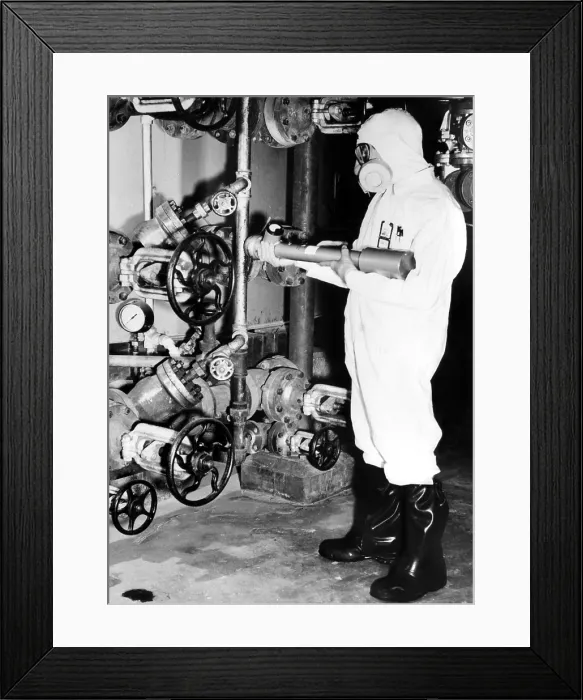 Framed Print : General Electric worker with a portable radiation detector checking for probable hot zones at the Hanford Atomic Products Operation, Richland, WA, 1955