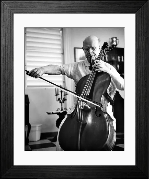 Framed Print : Pablo Casals celebrates his 85th birthday by smoking one of his 16 well used pipes and playing his cello. San Juan, Puerto Rico, December 29, 1961