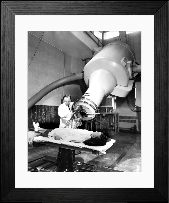 Framed Print : Simulating the treatment of a cancer patient, a doctor adjusts the X-ray machine at Frances Delafield Memorial Hospital, Columbia Presbyterian Medical Center, New York, New York Framed Print : Simulating the treatment of a cancer patient, a doctor adjusts the X-ray machine at Frances Delafield Memorial Hospital, Columbia Presbyterian Medical Center, New York, New York