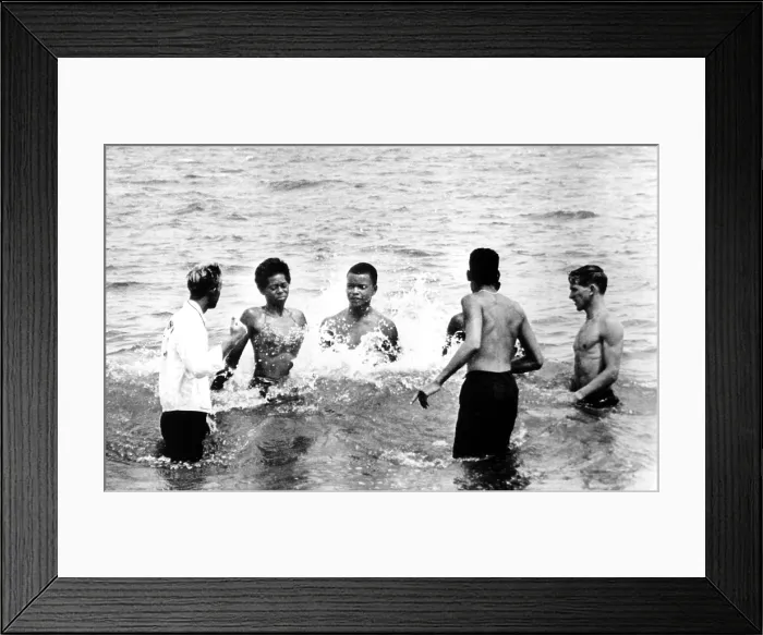 Framed Print : Segregation, African American boys and girls attempt to integrate a beach and are forced to leave Savannah Beach, GA by lifeguards. 07-14-1963 Framed Print : Segregation, African American boys and girls attempt to integrate a beach and are forced to leave Savannah Beach, GA by lifeguards. 07-14-1963
