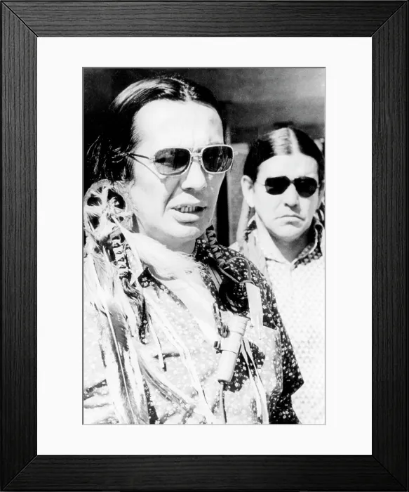 Framed Print : Russell Means, and Clyde Bellecourt, of AIM (American Indian Movement), after being arraigned in Federal Court for AIM's occupation of Wounded Knee. April 16, 1973 Framed Print : Russell Means, and Clyde Bellecourt, of AIM (American Indian Movement), after being arraigned in Federal Court for AIM's occupation of Wounded Knee. April 16, 1973