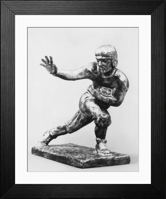 Framed Print : Heisman Memorial Trophy Award, awarded annually to the most outstanding U.S. collegiate football player, circa 1970s, Courtesy: CSU Archives / Everett Collection