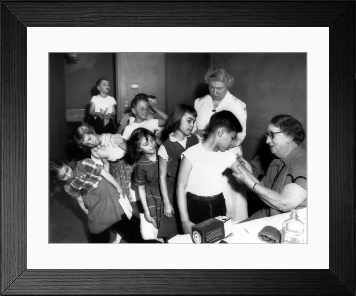 Framed Print : Dr. Nelle Reed gives vaccinations to Michigan city grammar school, 1956. Courtesy: CSU Archives  /  Everett Collection