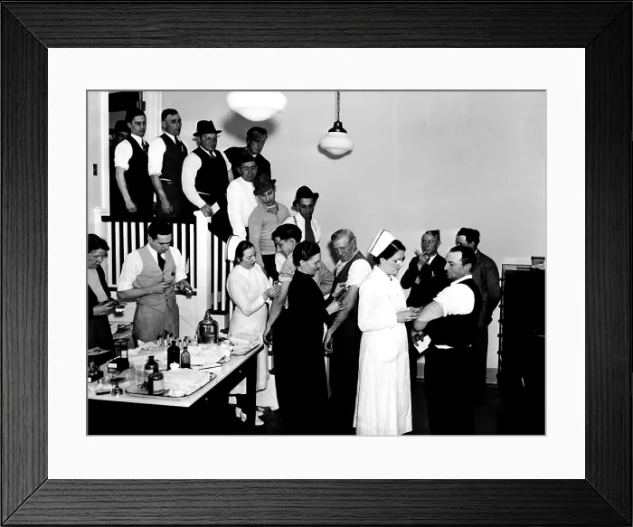 Framed Print : Averting epidemic in stricken Hartford. Emergency workers being Vaccinated against Typhoid Fever. 1936. Courtesy: CSU Archives / Everett Collection Framed Print : Averting epidemic in stricken Hartford. Emergency workers being Vaccinated against Typhoid Fever. 1936. Courtesy: CSU Archives / Everett Collection