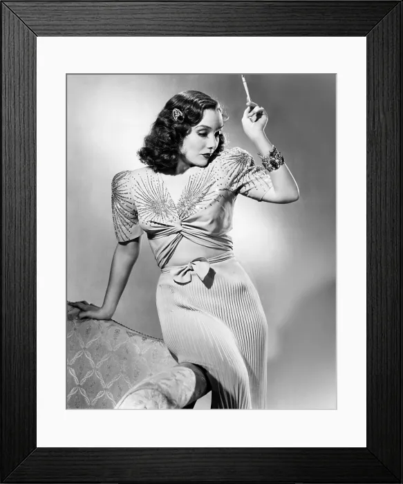 Framed Print : Lupe Velez, modeling two-piece blue crepe dinner gown with silver beads and sequins, and silver and saphire bracelets, 1940
