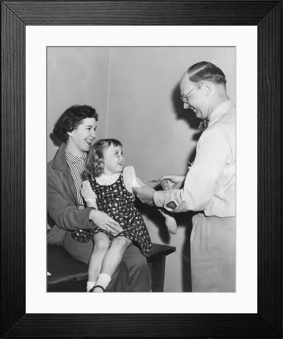 Framed Print : A young girl receiving a vaccine, circa 1950s. Courtesy: CSU Archives / Everett Collection Framed Print : A young girl receiving a vaccine, circa 1950s. Courtesy: CSU Archives / Everett Collection