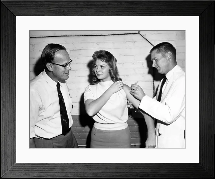 Framed Print : A woman receiving a vaccine, circa 1950s. Courtesy: CSU Archives / Everett Collection