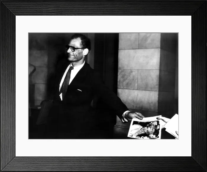 Framed Print : Arthur Miller, (1915-2005), American playwright and essayist, after his announcement that he and Marilyn Monroe (pictured in photograph he is holding), were engaged to be married