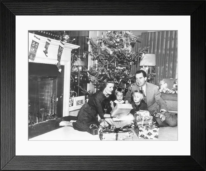 Framed Print : The Nixon family on Christmas Eve: Pat Nixon, Julie Nixon, Tricia Nixon, and Vice President Richard Nixon, Washington DC, December 24, 1953