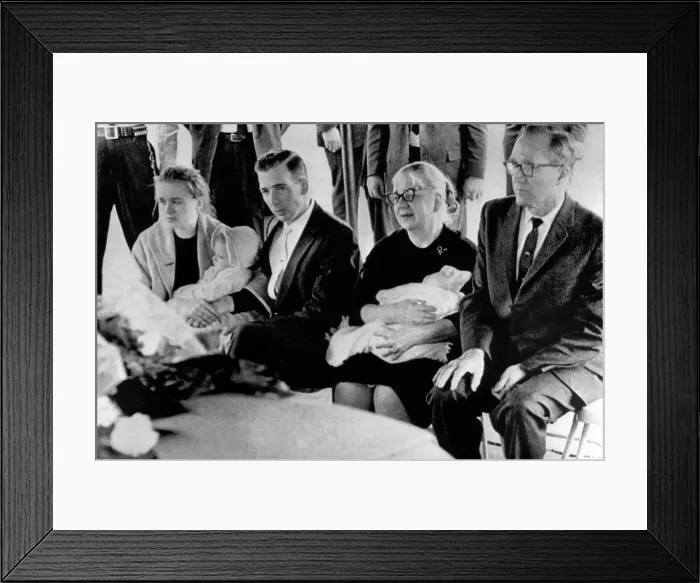 Framed Print : Lee Harvey Oswald's funeral: Marina Oswald, his widow, holding their daughter June, Robert L Framed Print : Lee Harvey Oswald's funeral: Marina Oswald, his widow, holding their daughter June, Robert L